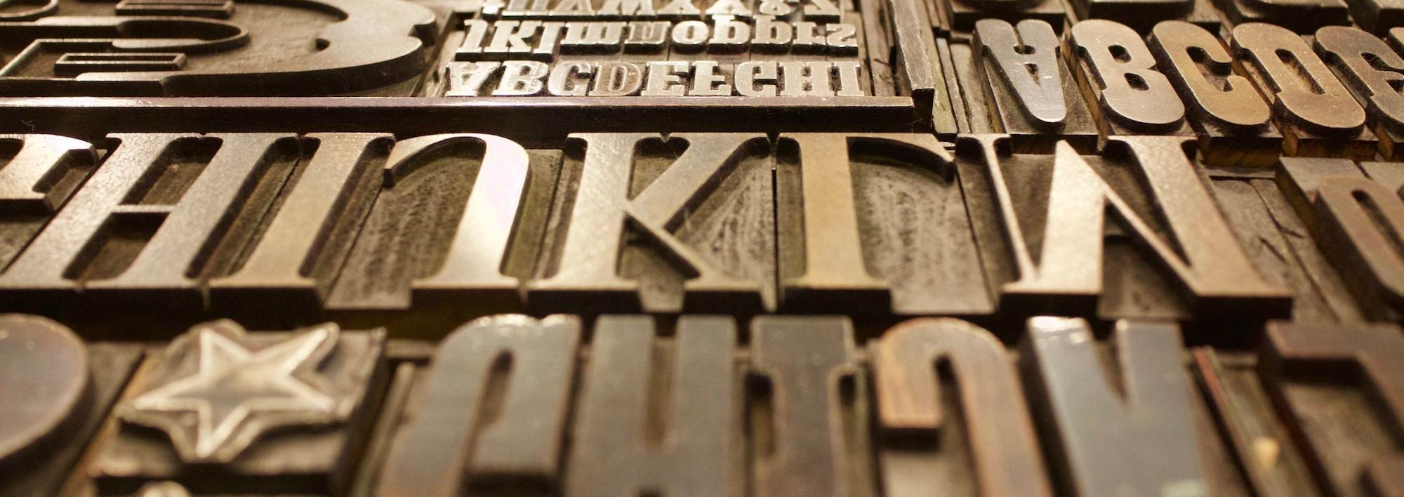 Vintage metal letterpress blocks spelling out 