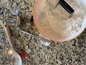 Grandma's Homemade Biscuits 2 Making Grandma's Homemade Biscuits: Flour, butter, and tools in a bowl on a granite countertop.