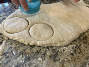 Grandma's Homemade Biscuits 4 Cutting Grandma's homemade biscuits from dough on a granite countertop. Lexington KY bakery.